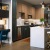 a kitchen with a bar stool and a table