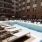 a pool with chairs around it