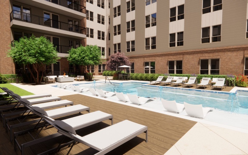 a swimming pool with chairs around it