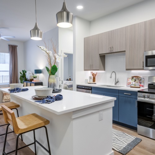 Kitchen island with stainless steel appliance