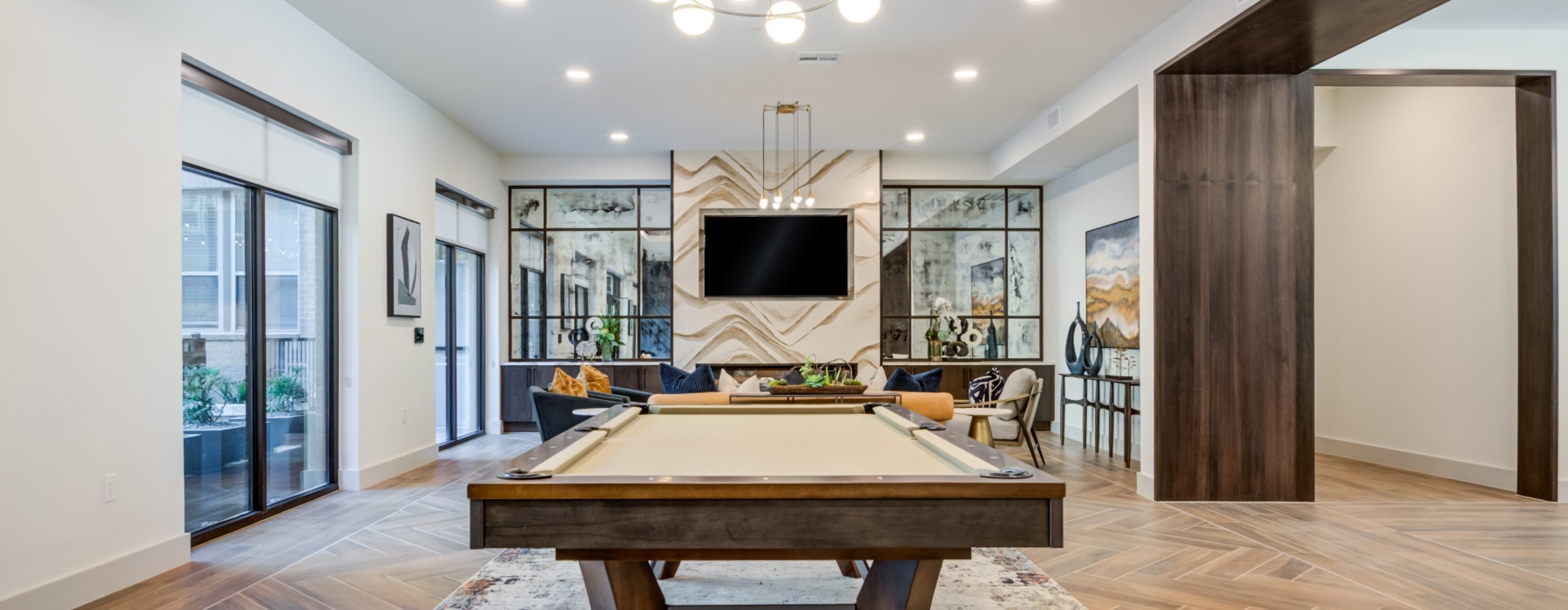 Large room with tv and pool table