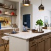 a kitchen with a marble island