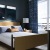a bedroom with a bed and lamps