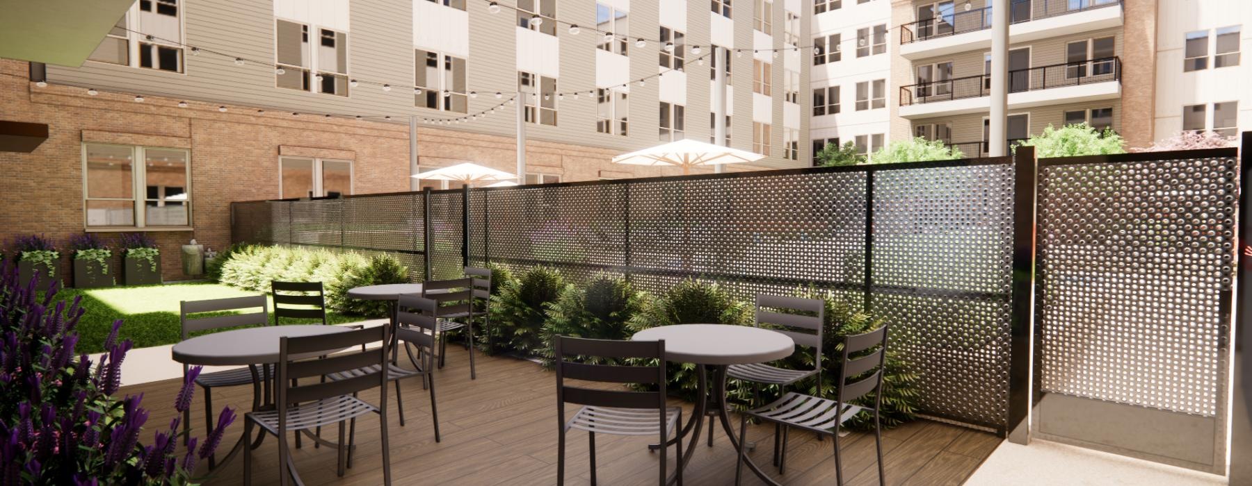 a patio with tables and chairs